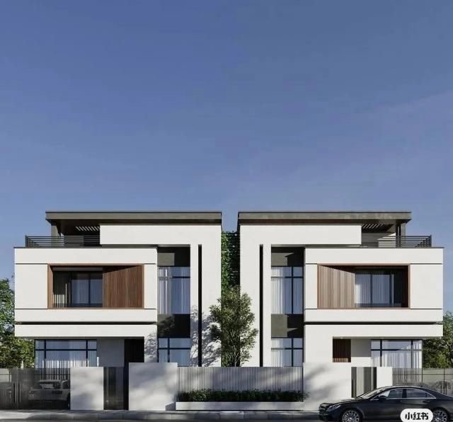Modern semi-detached duplex with large windows and wood accents
